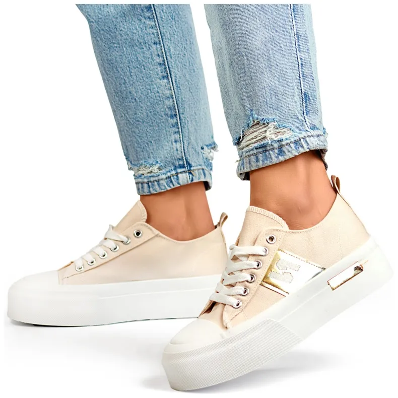 Beige fashionable women's sneakers with a thick platform sole