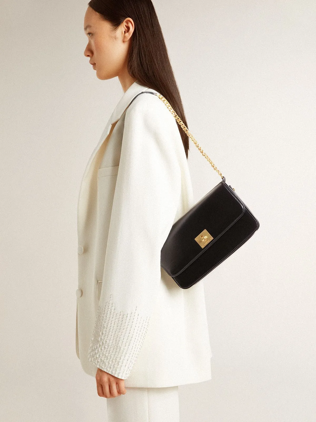 Gioia Bag in black boarded leather with gold details