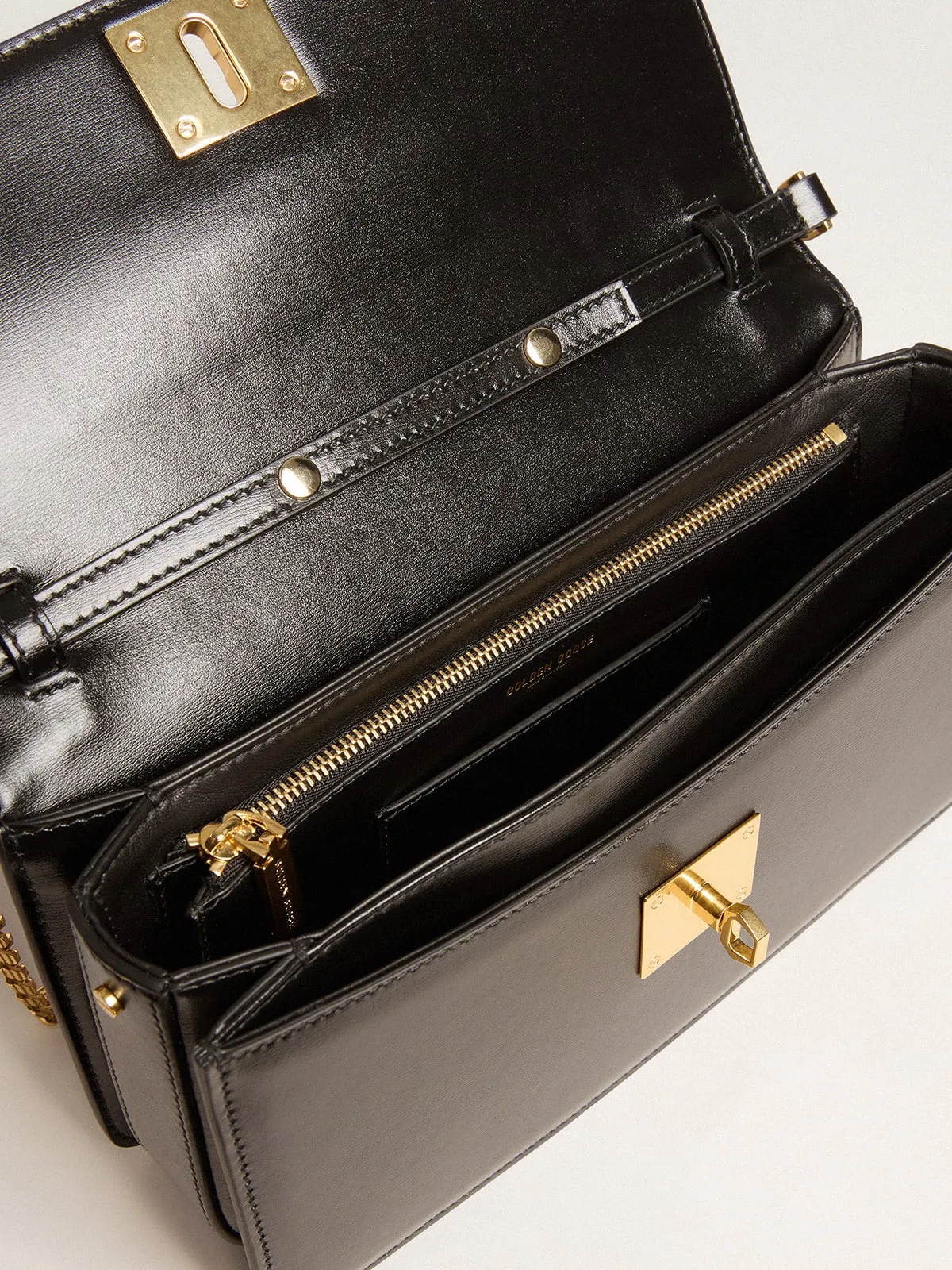 Gioia Bag in black boarded leather with gold details